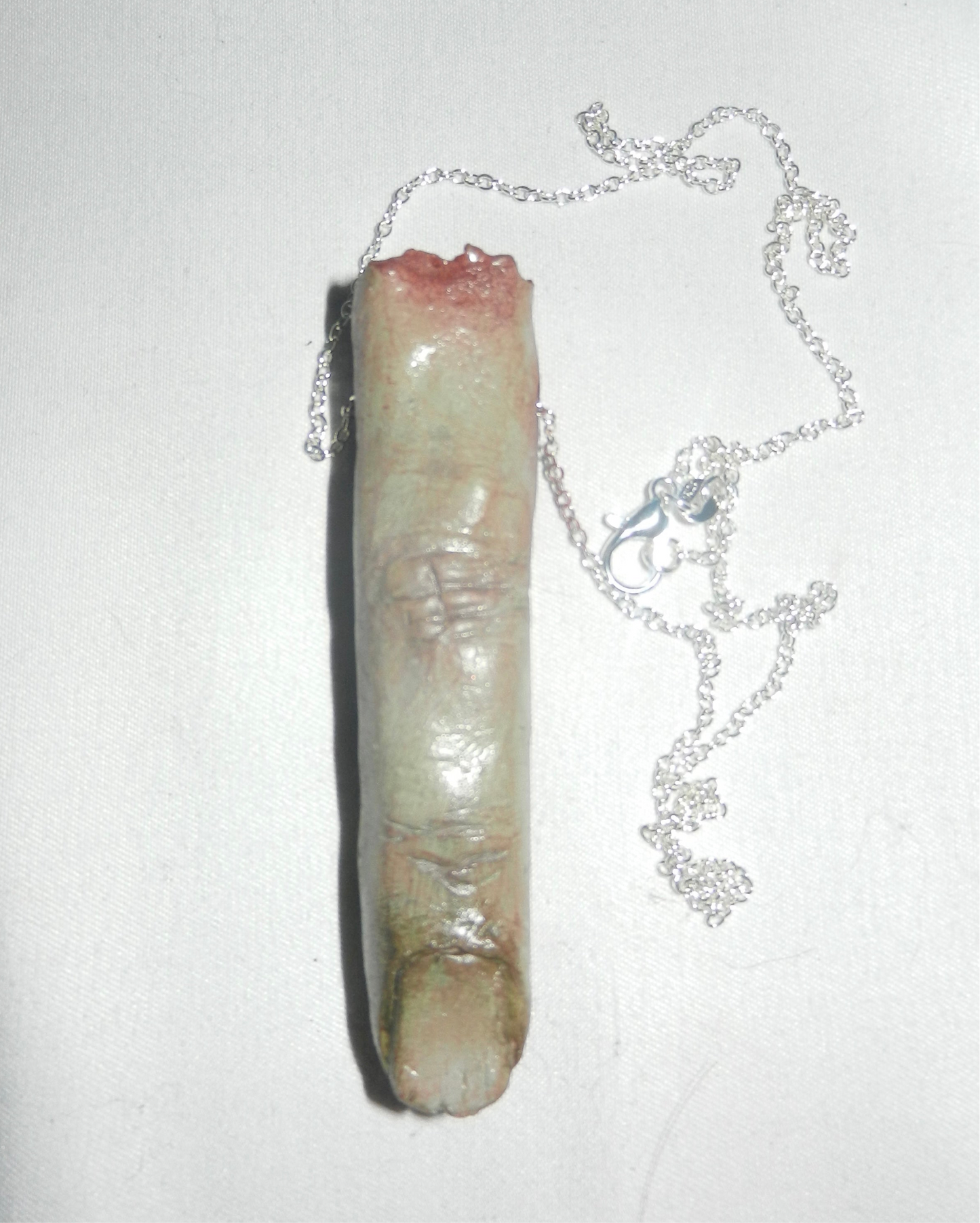 1/1 zombie severed finger necklace